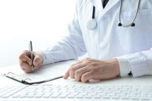 Doctor writing medical record