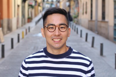 Asian man wearing eyeglasses outdoors