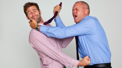Photo,Of,Two,Businessmen,Fighting,Against,A,Plain,Background,,Part
