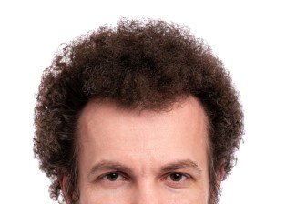 Close,Up,Cropped,Image,Of,Male,Head,With,Curly,Hair.